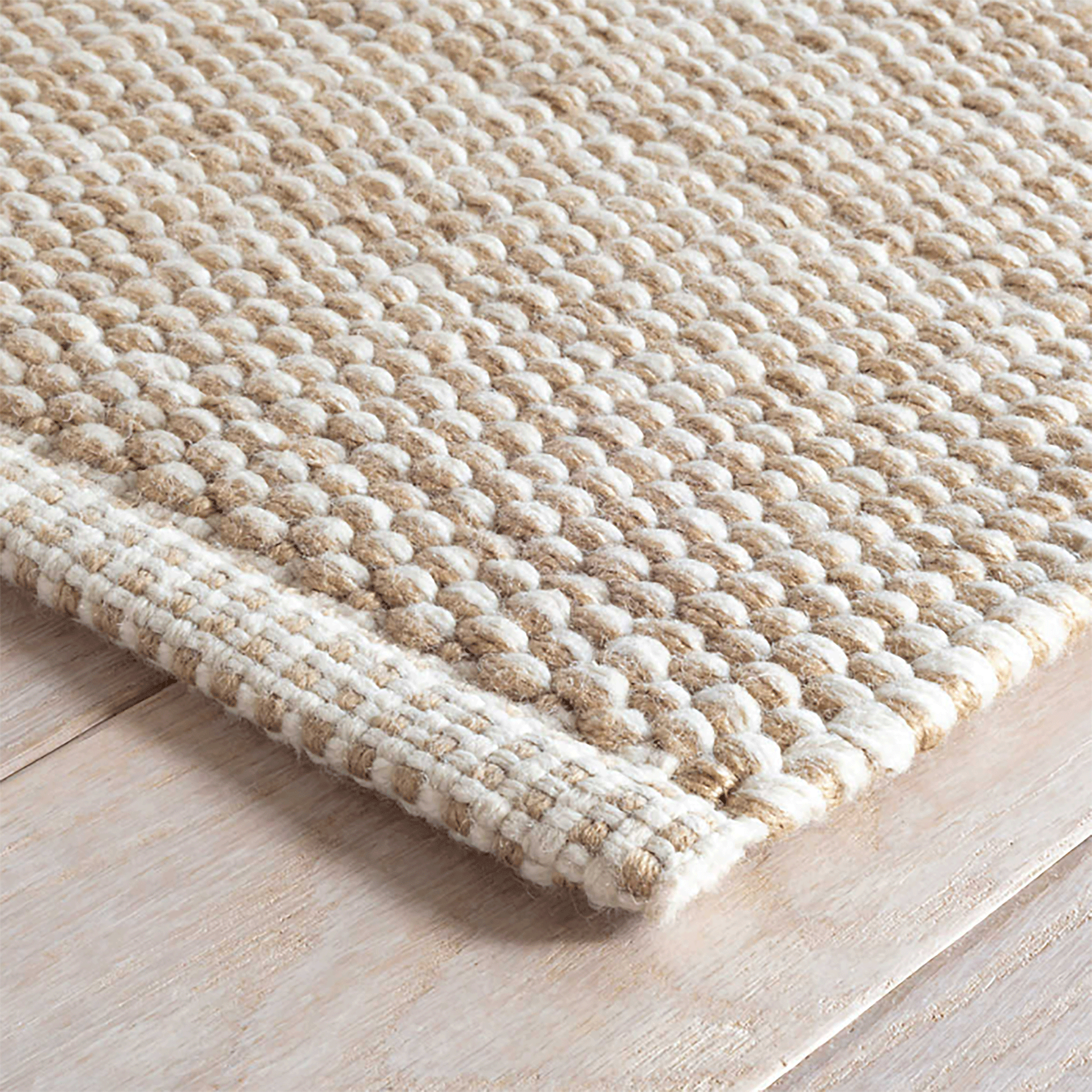 https://www.mainecottage.com/cdn/shop/products/pebble-natural-indoor-outdoor-rug-corner_2048x.gif?v=1653667466