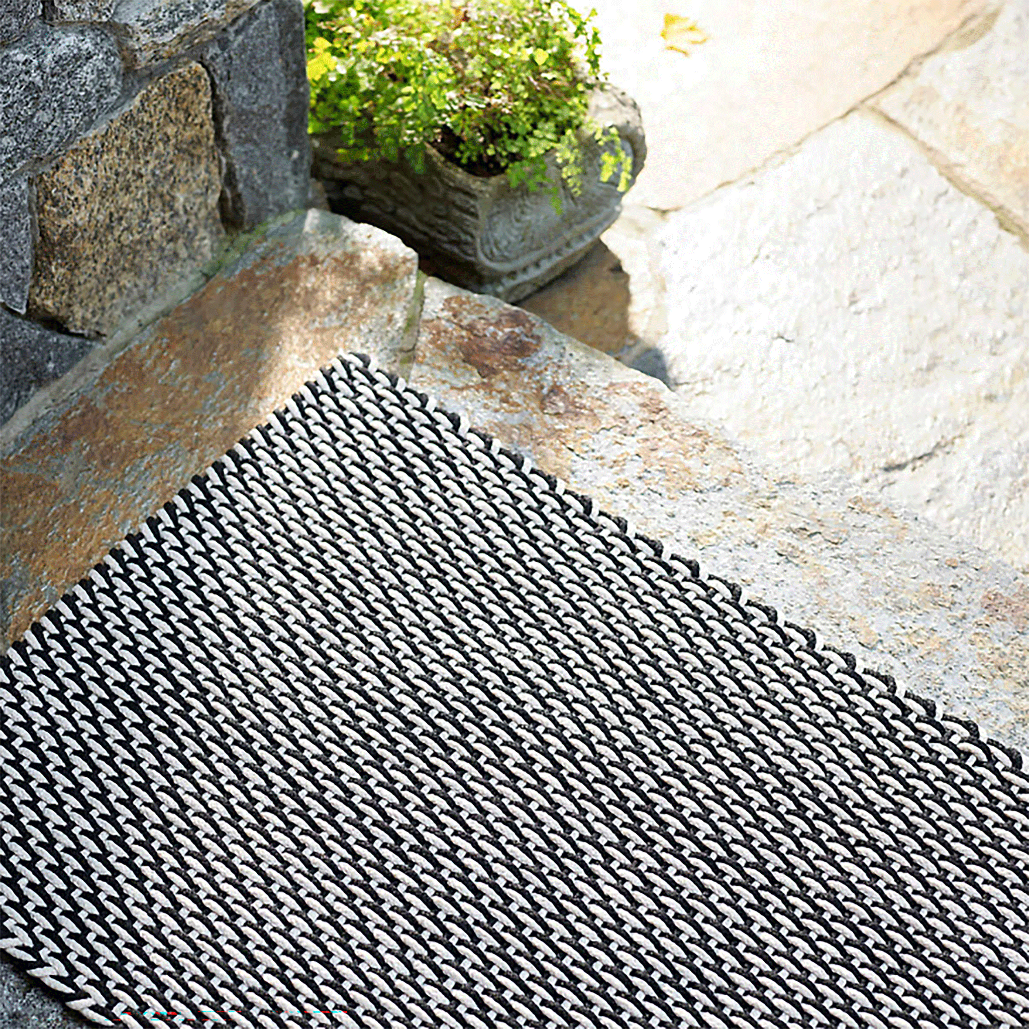 https://www.mainecottage.com/cdn/shop/products/two-tone-rope-black-ivory-indoor-outdoor-rug-detail_2048x.gif?v=1653694263